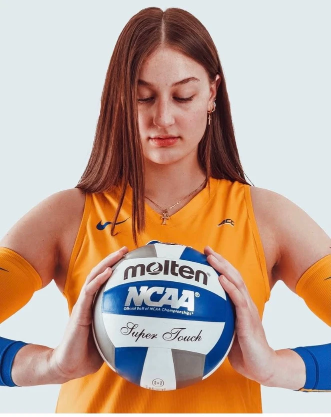 Portrait of Jessica Smallwood in a Pitt jersey holding a volleyball